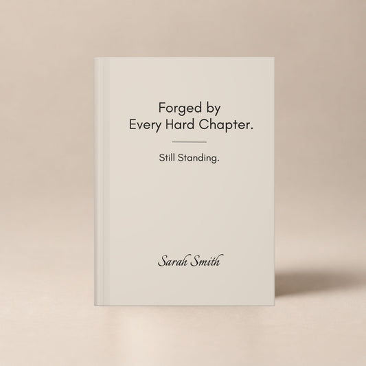 A personalized ivory hardcover journal standing upright against a soft beige studio background, showcasing the cover design by Momentum Prints.