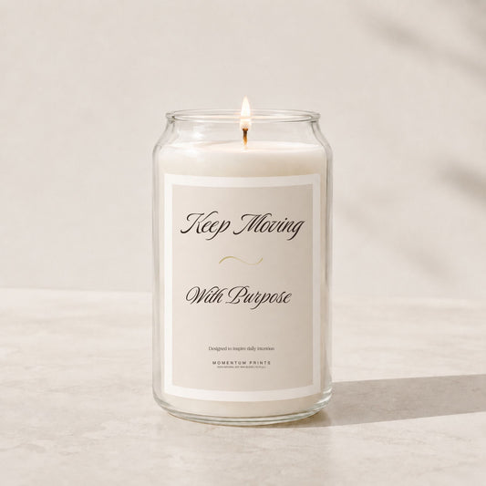 Minimalist luxury soy candle in a clear glass jar with a soft beige label reading “Keep Moving With Purpose,” styled on a light stone surface with warm natural lighting and a clean neutral background.