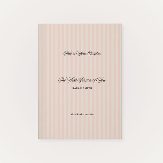 Premium personalized hardcover journal with a dusty rose striped cover and black script lettering, shown on a clean white background by Momentum Prints.