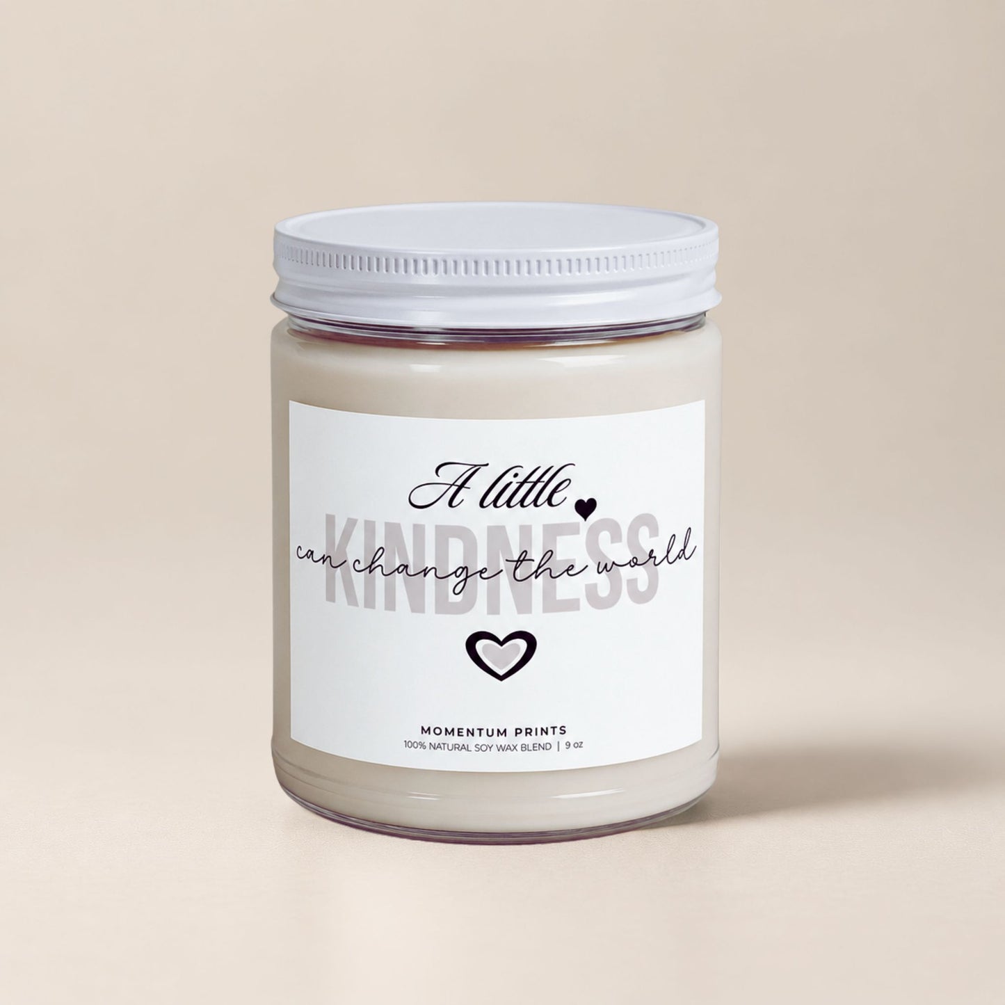 A Little Kindness Can Change the World scented soy candle by Momentum Prints with minimalist white label and soft beige background.