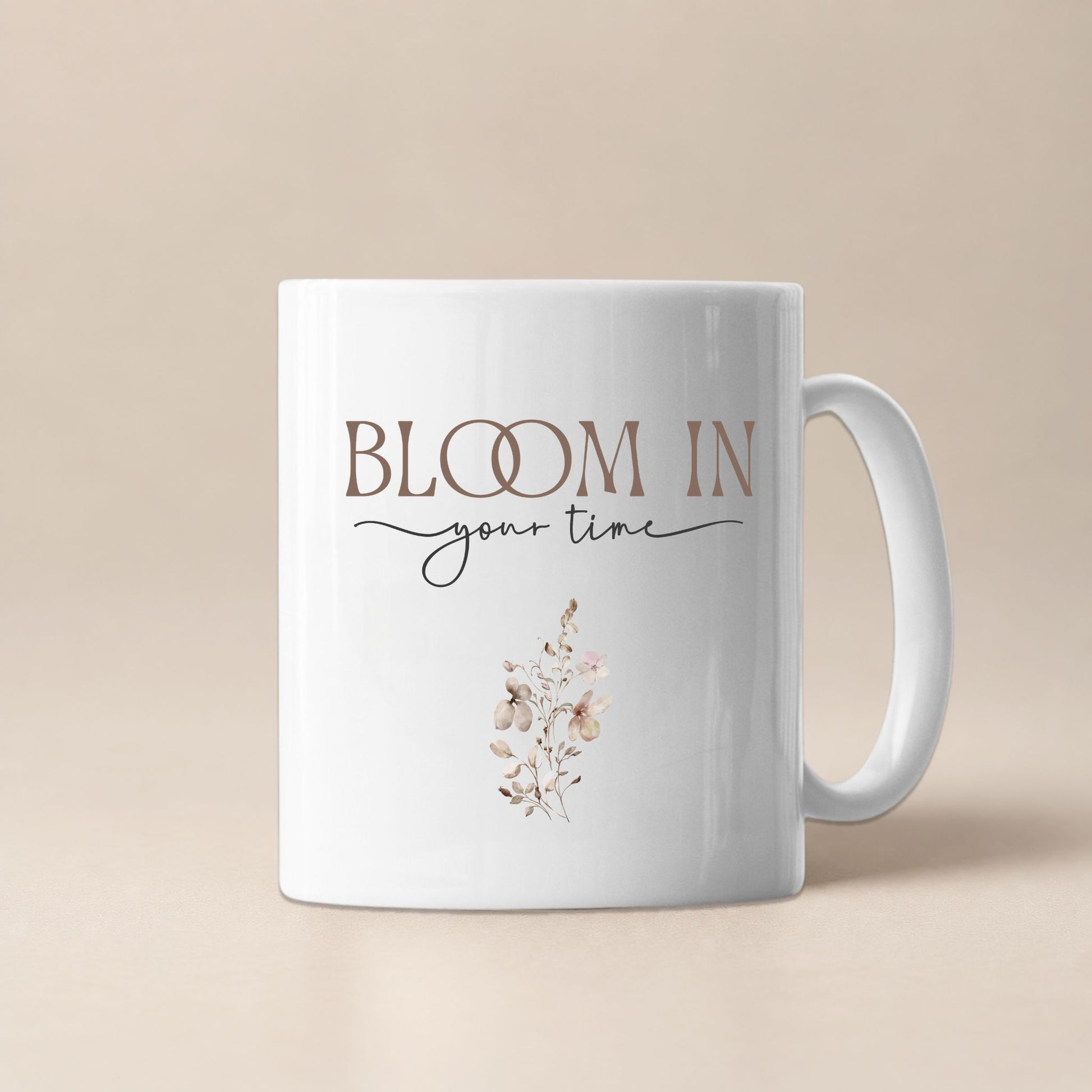 Bloom In Your Time motivational mug by Momentum Prints, front view on a soft beige background with minimalist floral design and elegant typography.