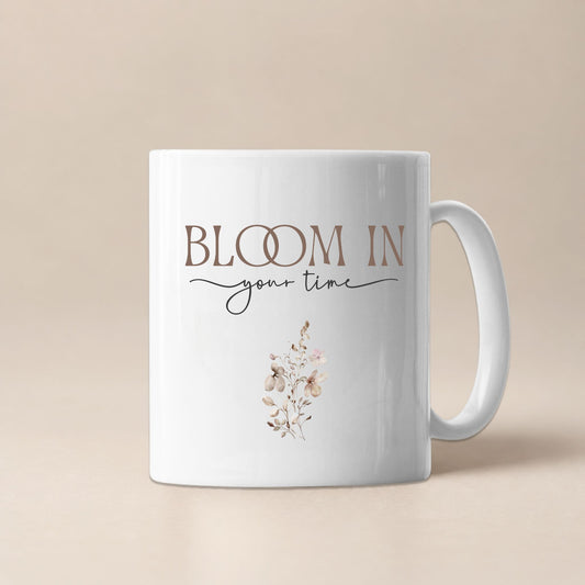 Bloom In Your Time motivational mug by Momentum Prints, front view on a soft beige background with minimalist floral design and elegant typography.