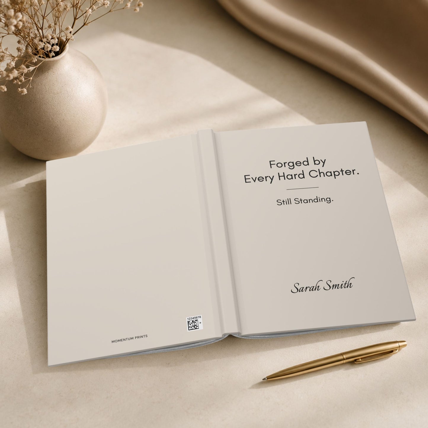 Interior view of a personalized ivory hardcover journal, showing the Momentum Prints wordmark and production barcode on the inside cover by Momentum Prints.