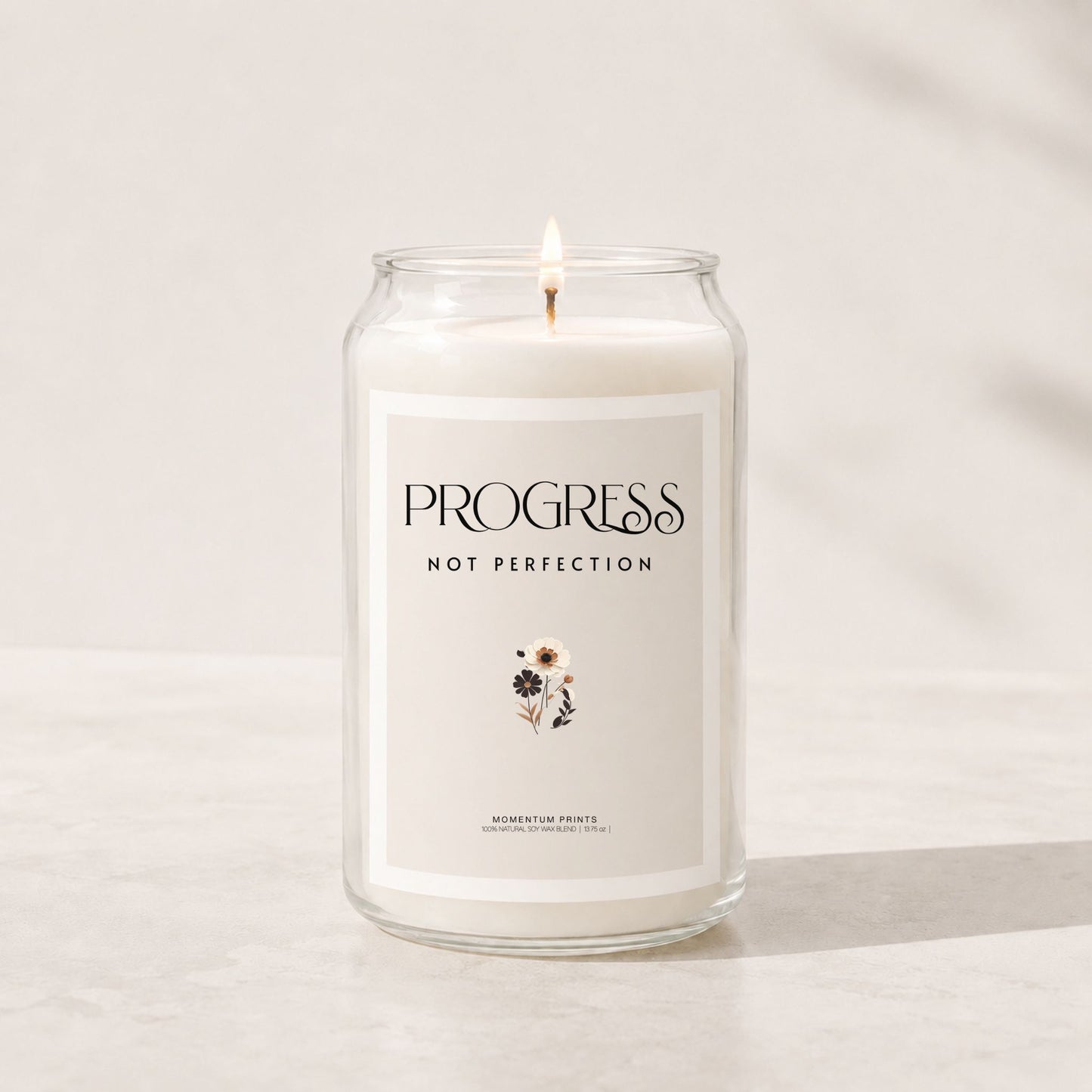 Minimalist luxury soy candle with a blank light beige label in a clear glass jar, styled in a soft neutral setting with warm natural lighting and clean spa-inspired aesthetics.