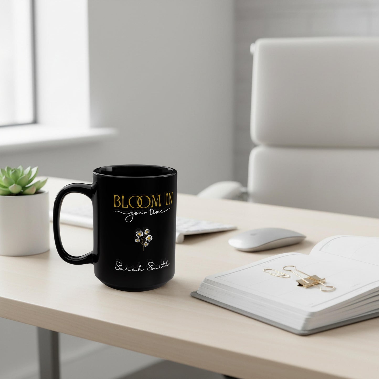 Personalized black ceramic mug with “Bloom in Your Time” design and custom name, styled on a clean office desk with planner and neutral workspace accessories.