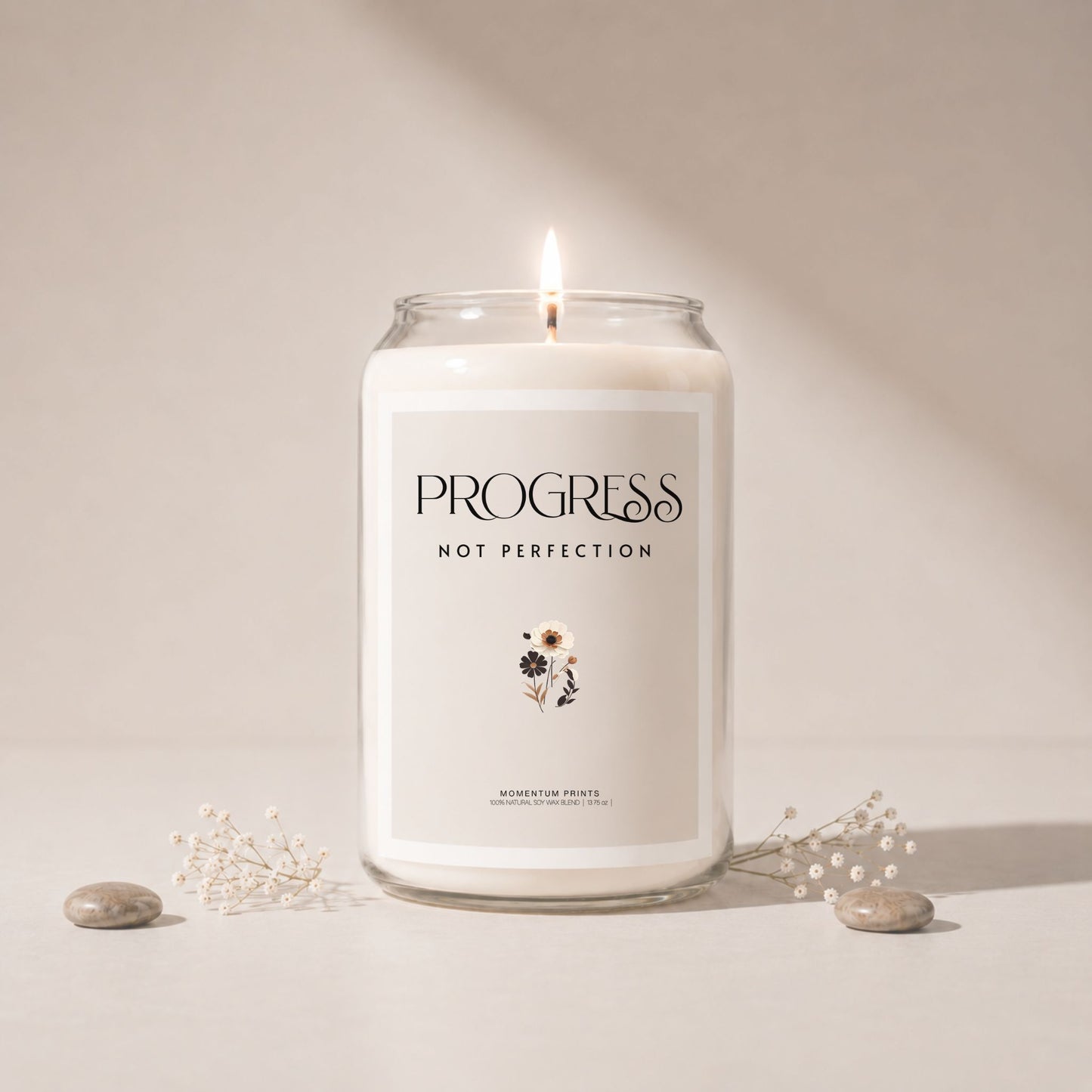 Minimalist luxury soy candle mockup with soft beige background, lit candle in clear glass jar, delicate floral accents and smooth stones, styled in soft natural light with elegant spa-inspired aesthetic.