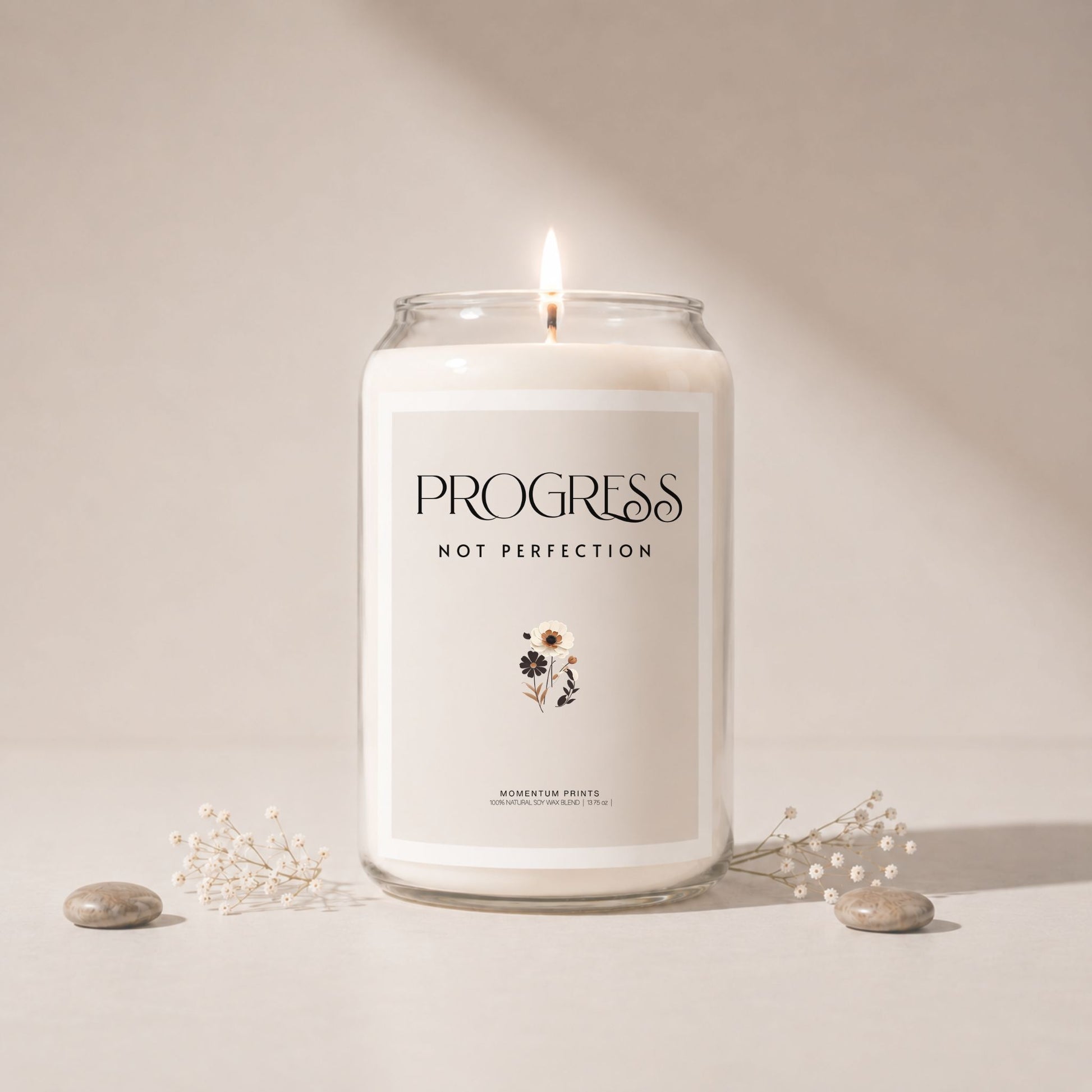 Minimalist luxury soy candle mockup with soft beige background, lit candle in clear glass jar, delicate floral accents and smooth stones, styled in soft natural light with elegant spa-inspired aesthetic.