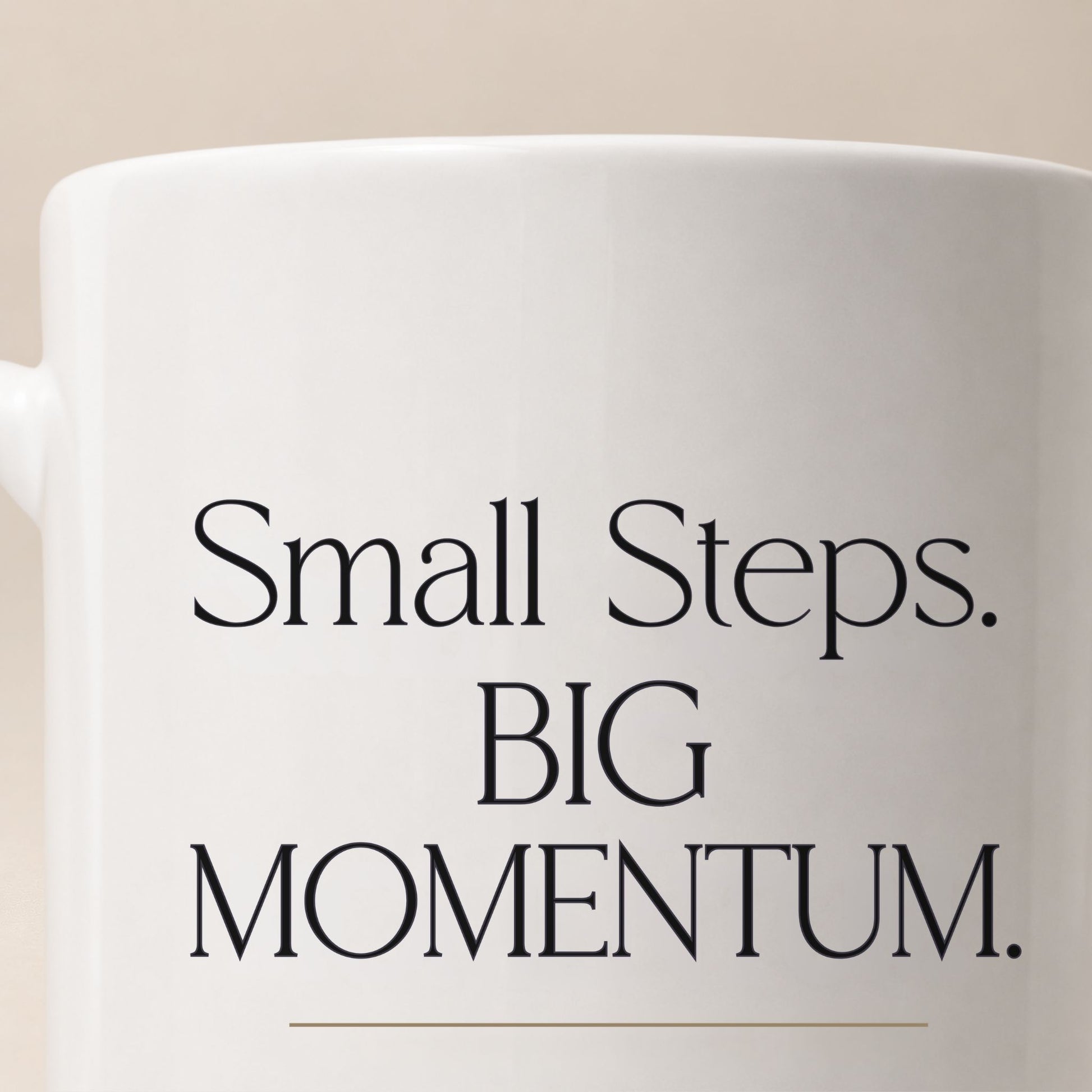 Close-up of the Small Steps. BIG MOMENTUM. design printed on a white ceramic mug, highlighting crisp typography, sharp print quality, and glossy ceramic finish.  Momentum Prints.