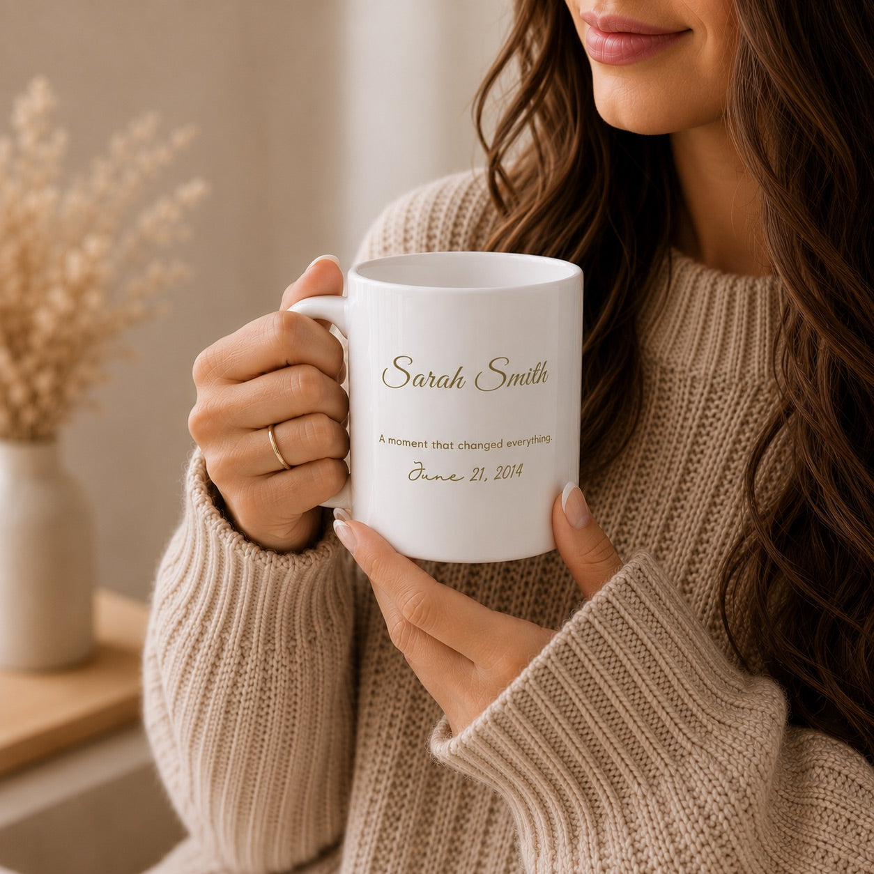Personalized memory mug featuring a custom name and special date, held by a woman in a cozy sweater, thoughtful gift idea captured in warm neutral lifestyle photography.