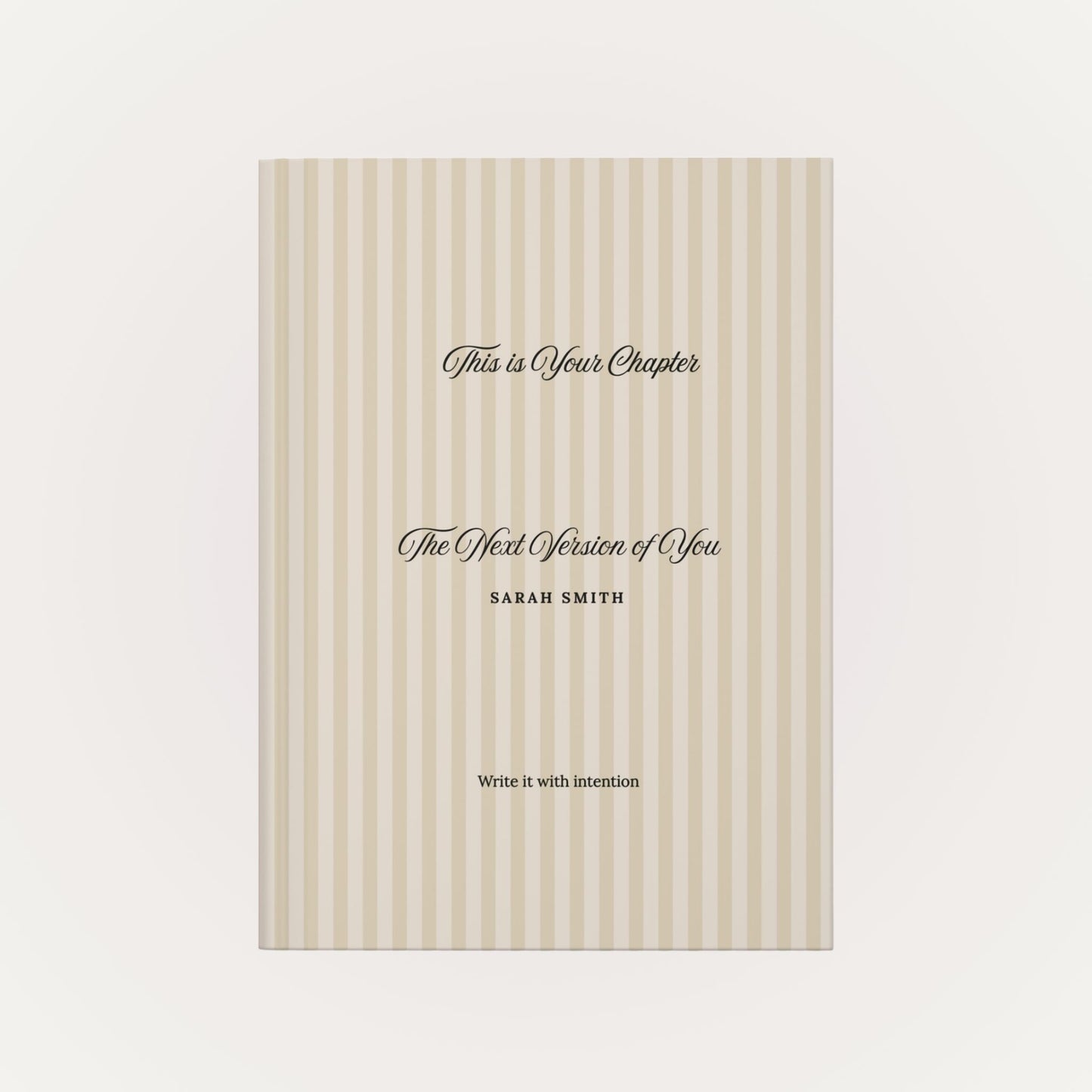 Front view of personalized hardcover journal with beige striped cover and custom name on a clean neutral background by Momentum Prints.