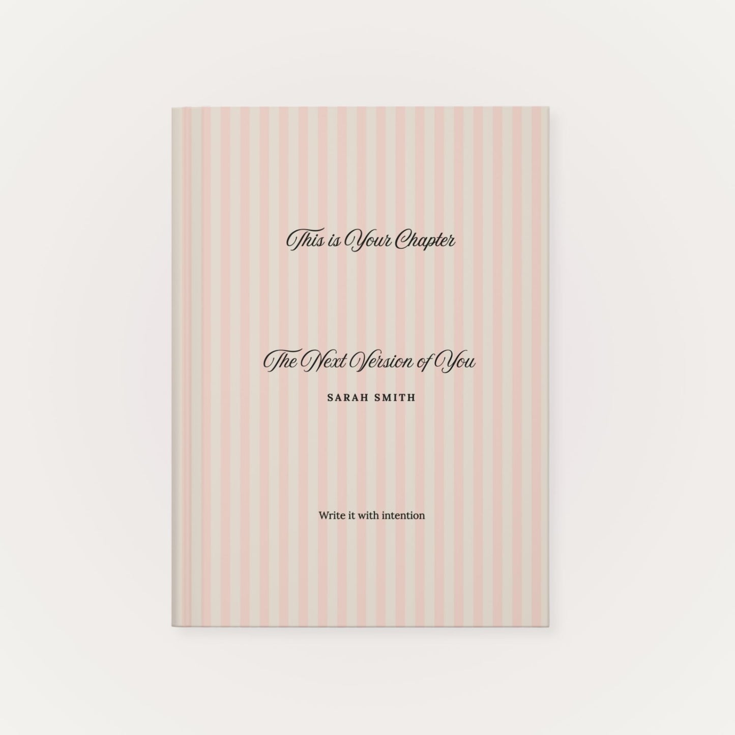 Premium personalized hardcover journal with a dusty rose striped cover and black script lettering, shown on a clean white background by Momentum Prints.