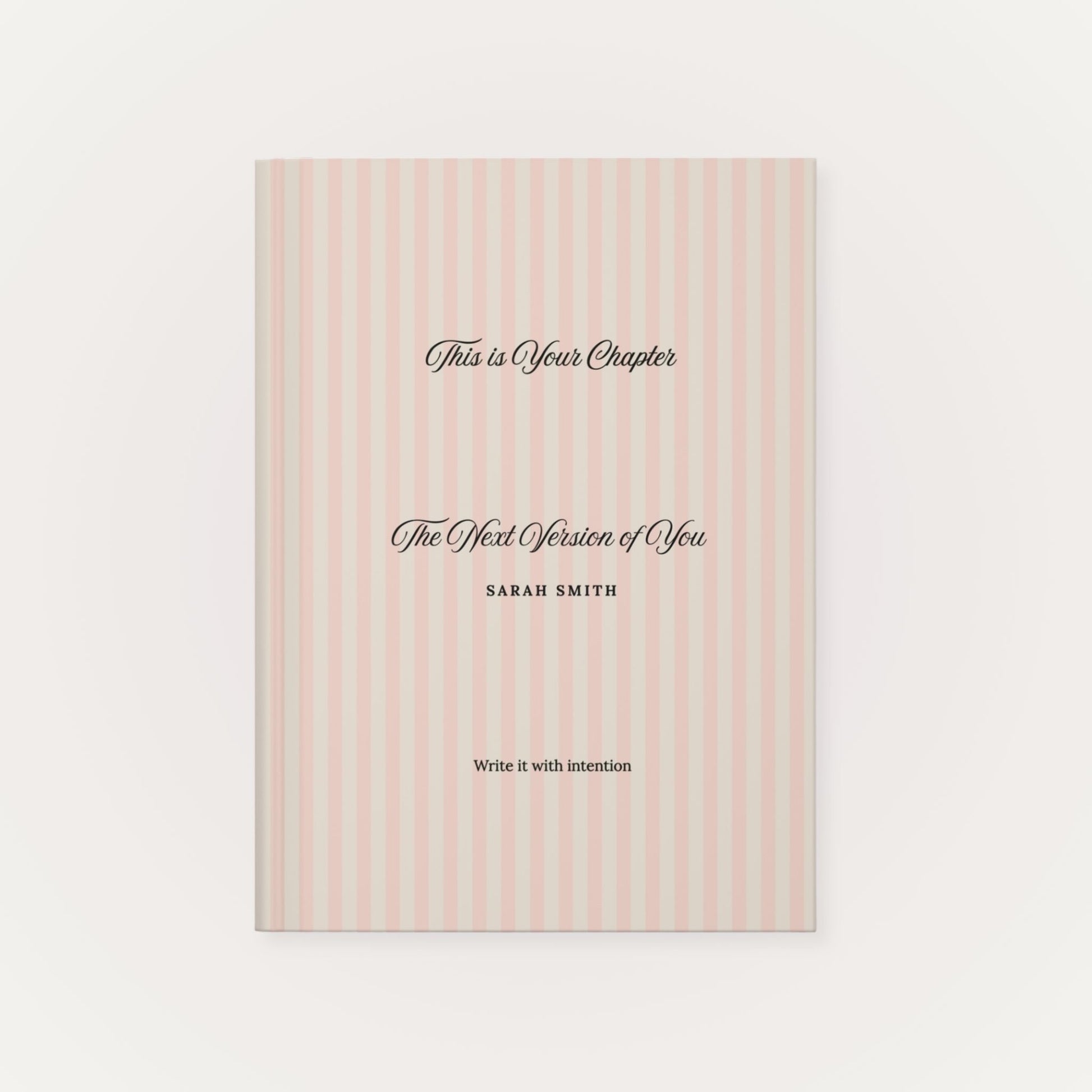 Premium personalized hardcover journal with a dusty rose striped cover and black script lettering, shown on a clean white background by Momentum Prints.